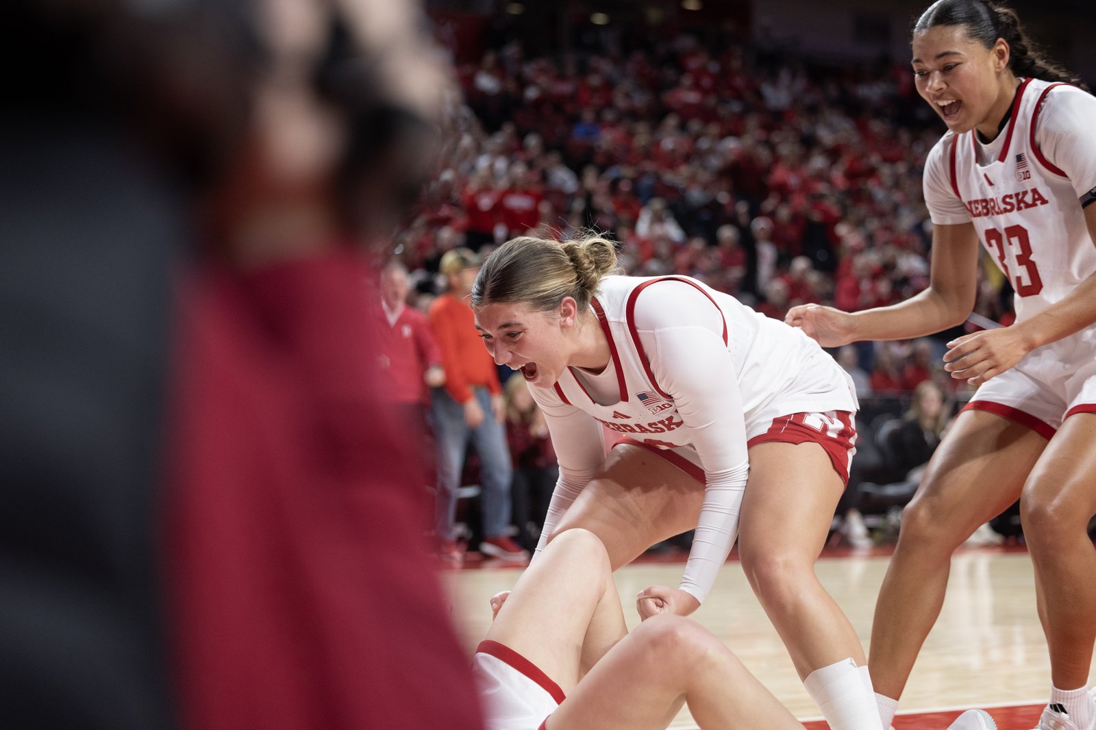 Logan Nissley celebrating on the court during a Nebraska game