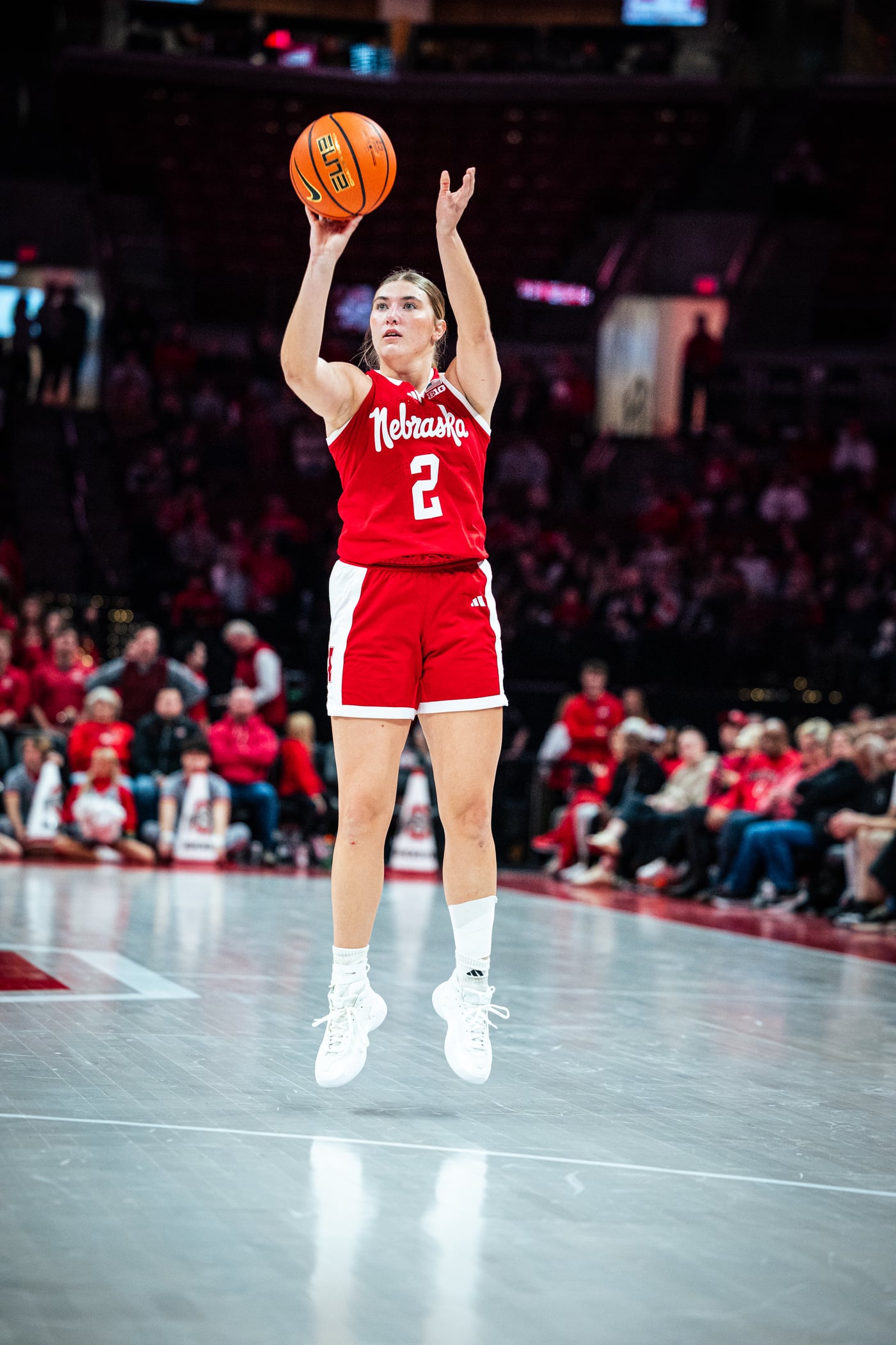 Logan Nissley shooting a jump shot in a Nebraska arena